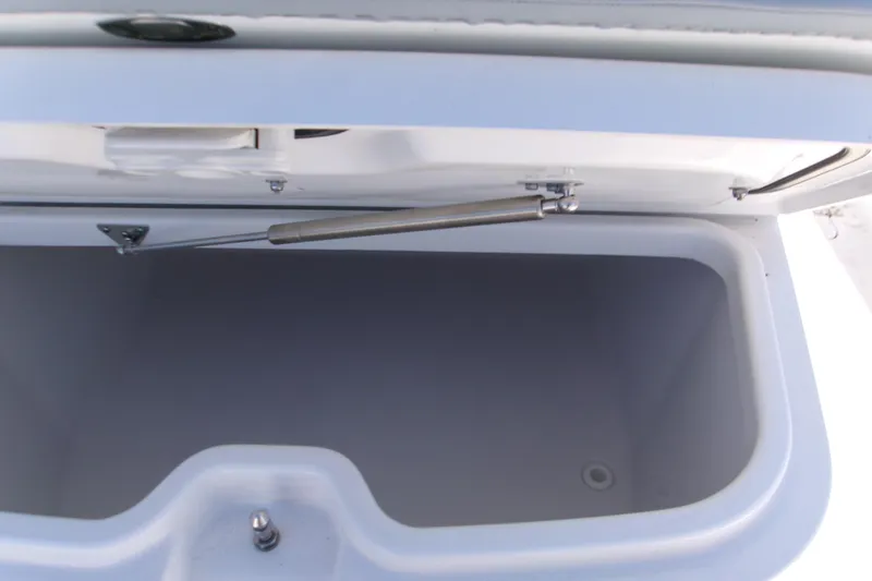 Slide: The Image of Open storage compartment on 2026 Sportsman Heritage 321 Center Console boat. - 21