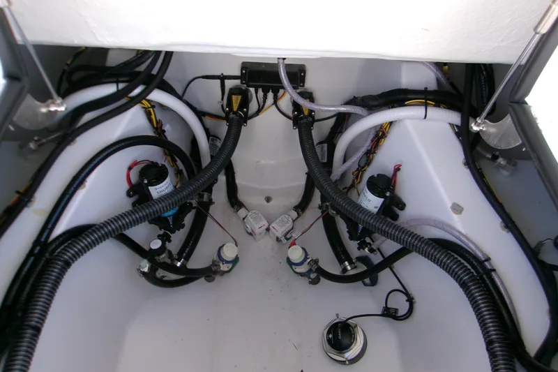 Slide: The Image of 2026 Sportsman Heritage 321 Center Console boat wiring and plumbing system. - 6