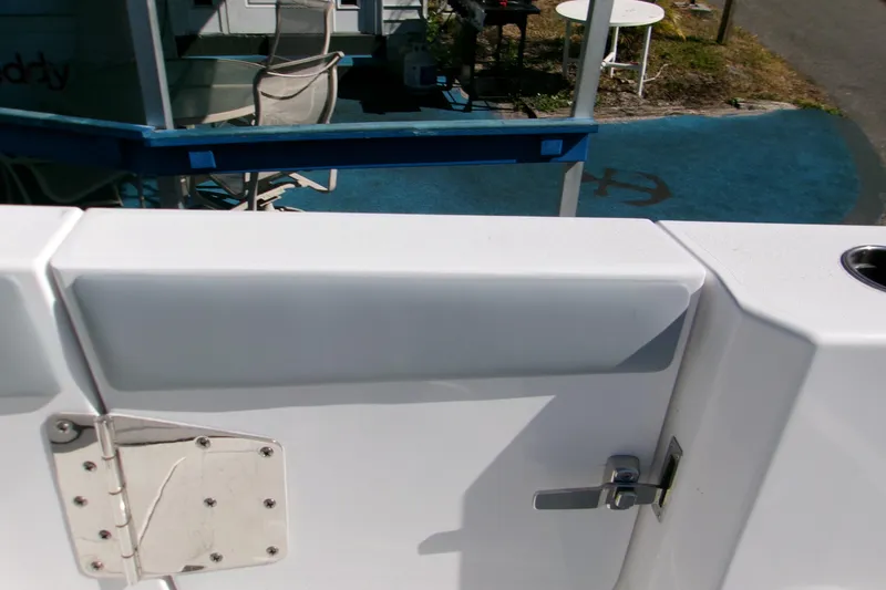 Slide: The Image of 2026 Sportsman Heritage 321 Center Console boat detail with latch and hinge. - 7