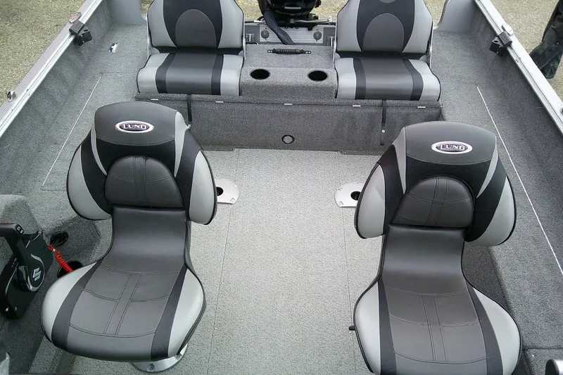 Slide: The Image of 2016 Lund 1775 Impact Sport boat interior with four cushioned seats. - 7