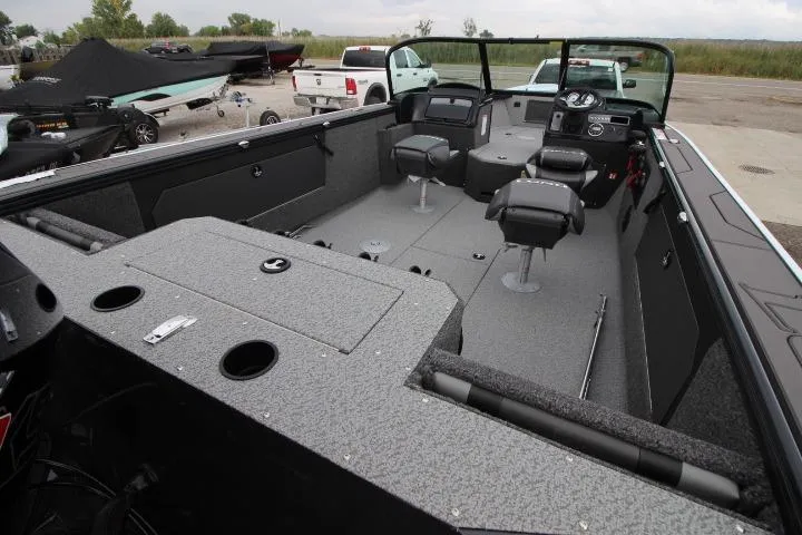 Slide: The Image of 2026 Lund 2075 Fisherman boat interior with seating and storage compartments. - 12