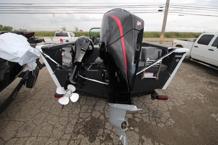 Slide: The Image of 2026 Lund 2075 Fisherman boat with dual outboard motors on a trailer. - 2