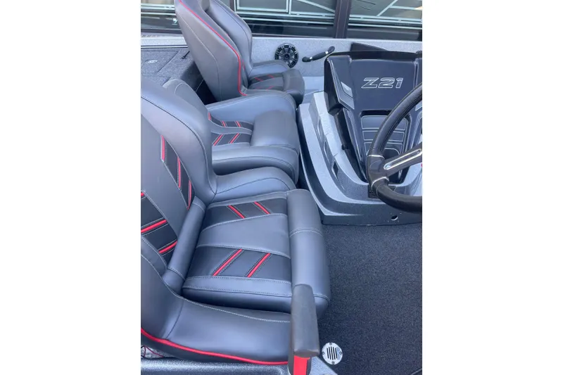 Slide: The Image of 2021 Nitro Z21 Pro boat interior with sleek black and red seats. - 4