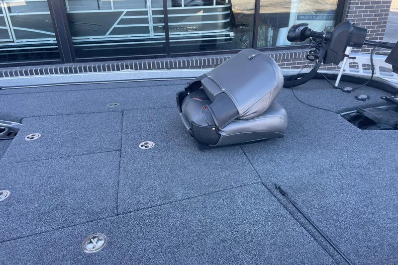 Slide: The Image of 2021 Nitro Z21 Pro boat deck with folded seat and storage compartments. - 6