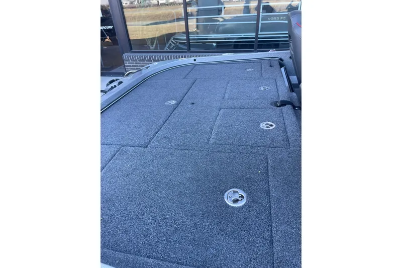 Slide: The Image of 2021 Nitro Z21 Pro boat deck with storage compartments, gray carpet finish. - 9