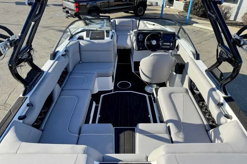 Slide: The Image of 2026 Moomba Craz boat interior with sleek seating and modern dashboard design. - 11