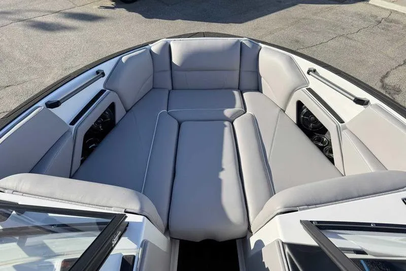 Slide: The Image of 2026 Moomba Craz boat interior with gray cushioned seating and sleek design. - 12