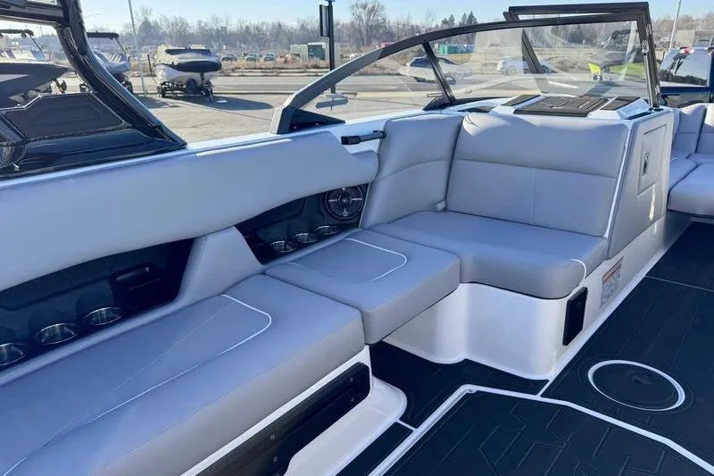 Slide: The Image of 2026 Moomba Craz boat interior with sleek gray seating and modern design. - 14