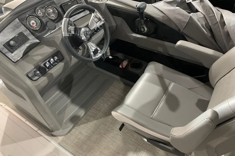 Slide: The Image of 2022 Avalon LSZ 2485 VRB boat interior with steering wheel and control panel. - 10