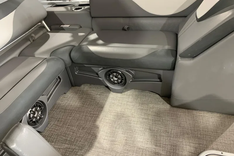 Slide: The Image of 2022 Avalon LSZ 2485 VRB interior with gray seating and built-in speakers. - 11