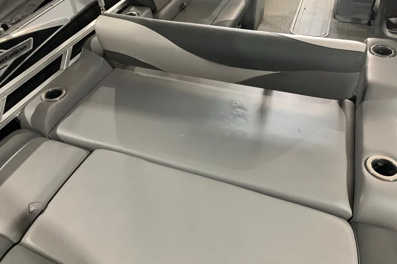 Slide: The Image of 2022 Avalon LSZ 2485 VRB boat interior with gray seating and cup holders. - 13