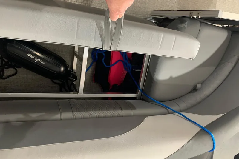 Slide: The Image of 2022 Avalon LSZ 2485 VRB boat seat storage with blue rope and marpac fender. - 18