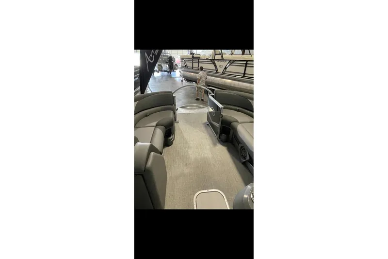 Slide: The Image of 2022 Avalon LSZ 2485 VRB pontoon boat interior with spacious seating and modern design. - 2