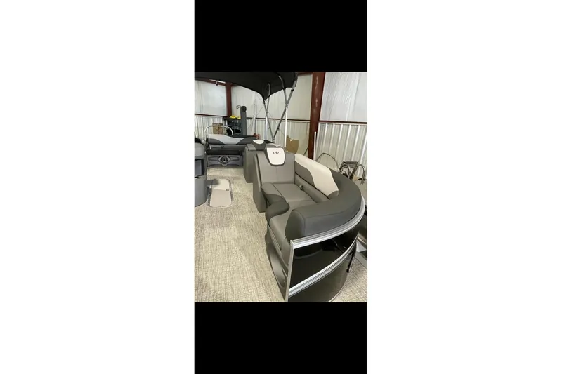 Slide: The Image of 2022 Avalon LSZ 2485 VRB pontoon boat with sleek seating and modern design. - 22