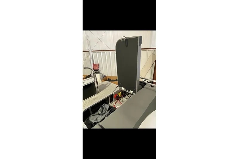 Slide: The Image of 2022 Avalon LSZ 2485 VRB boat interior with open storage compartment. - 25