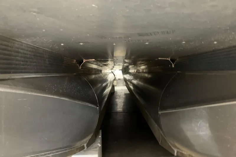 Slide: The Image of Underneath view of 2022 Avalon LSZ 2485 VRB pontoon boat, showcasing dual pontoons. - 27