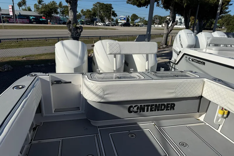 Slide: The Image of 2006 Contender 33 Tournament boat with Yamaha engines, docked outdoors. - 17