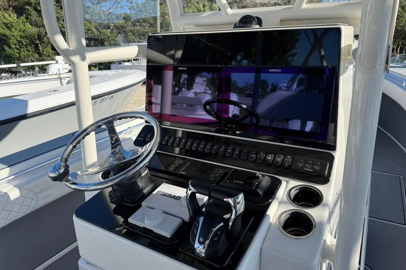 Slide: The Image of Center console of a 2006 Contender 33 Tournament boat with Simrad electronics. - 19