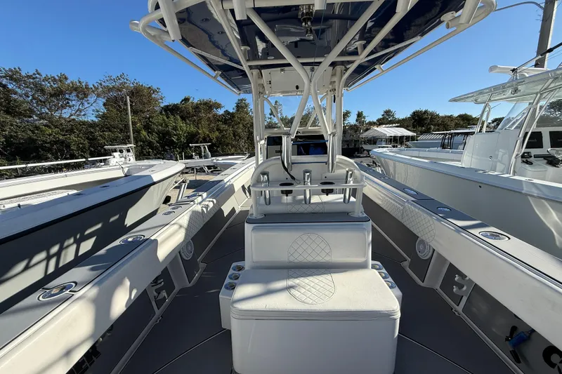 Slide: The Image of 2006 Contender 33 Tournament boat interior with seating and rod holders. - 21