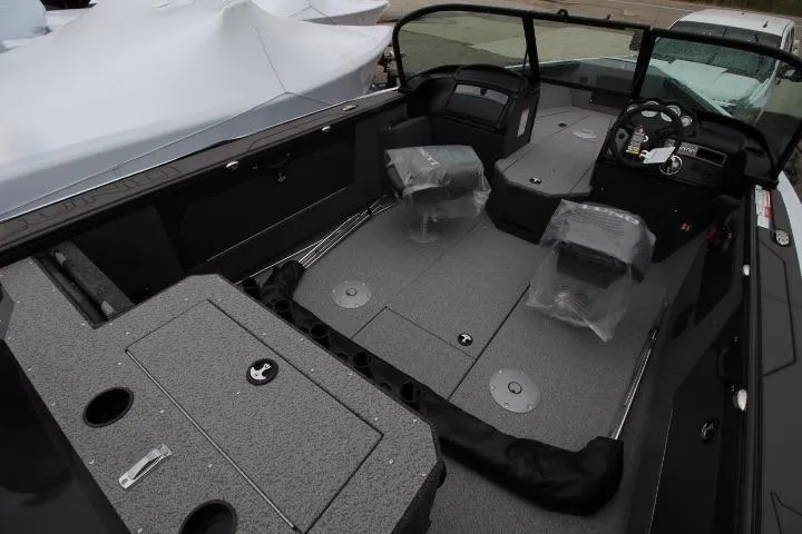 Slide: The Image of 2026 Lund 1875 Fisherman boat interior with seating and control console. - 6