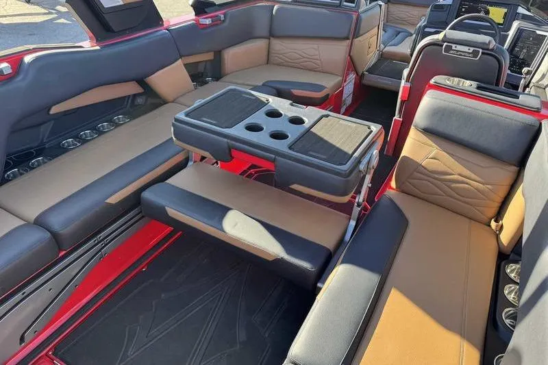 Slide: The Image of 2025 Supra SE boat interior with luxurious seating and cup holders. - 14