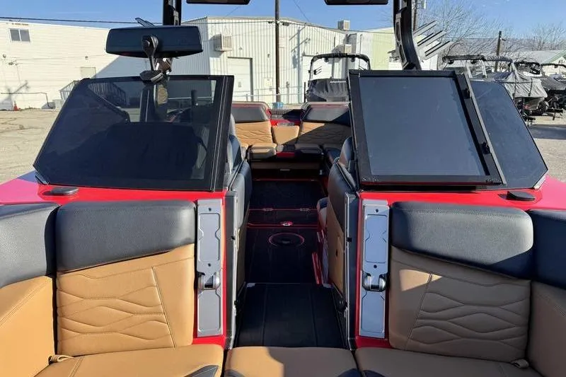 Slide: The Image of 2025 Supra SE boat interior with tan and black seating, dual windshields, and modern design. - 15