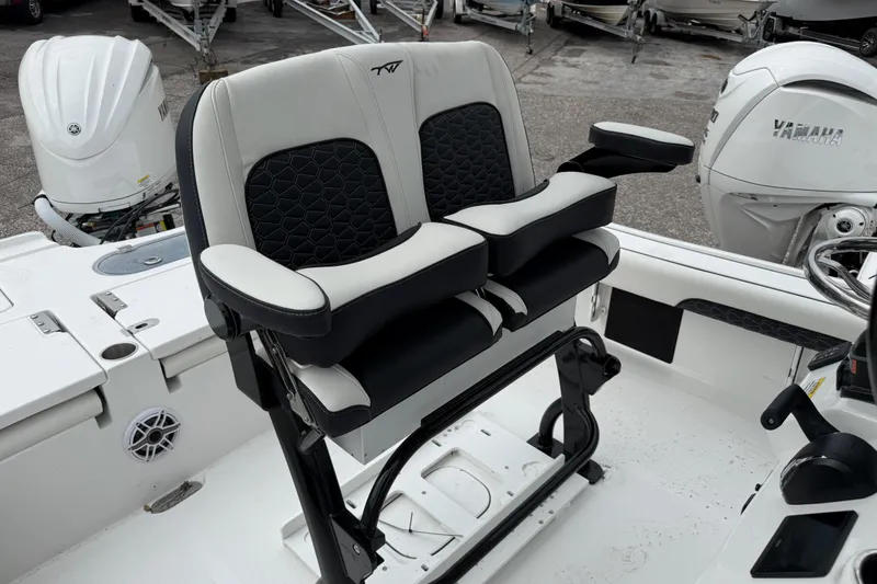 Slide: The Image of 2026 Tidewater 2500 Carolina Bay boat seats with Yamaha outboard motor in background. - 3
