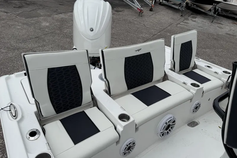 Slide: The Image of 2026 Tidewater 2500 Carolina Bay boat seats with cup holders and speakers. - 5
