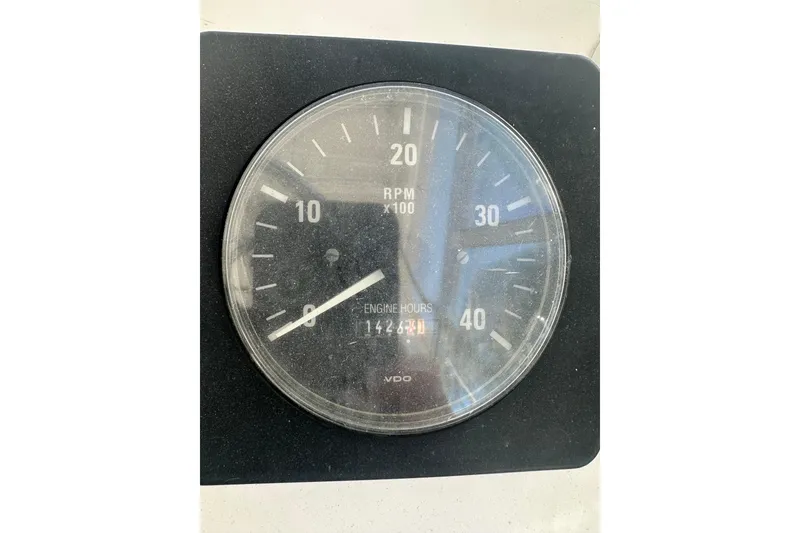 Slide: The Image of Close-up of a 2002 Mainship Pilot 34 tachometer showing 1428 engine hours. - 16