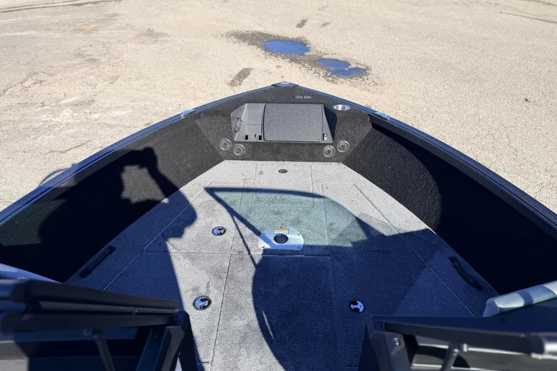 Slide: The Image of 2025 Alumacraft Competitor 185X Sport boat interior with spacious deck and storage compartments. - 19