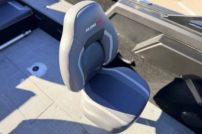 Slide: The Image of 2025 Alumacraft Competitor 185X Sport boat seat, gray and black design, top view. - 28