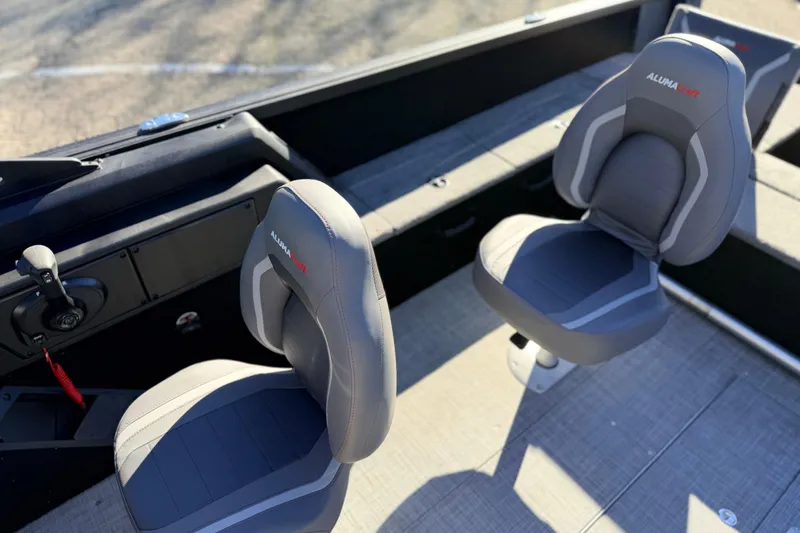 Slide: The Image of 2025 Alumacraft Competitor 185X Sport boat interior with two gray seats. - 29