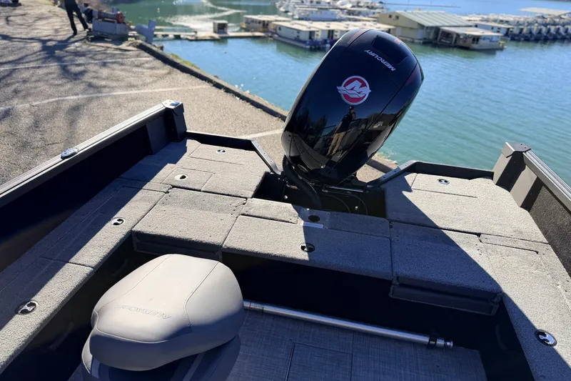 Slide: The Image of 2025 Alumacraft Competitor 185X Sport boat with Mercury engine at marina. - 31