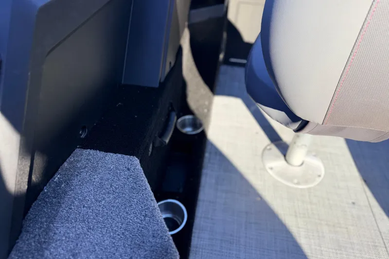 Slide: The Image of Interior of 2025 Alumacraft Competitor 185X Sport boat, featuring seating and cup holders. - 36