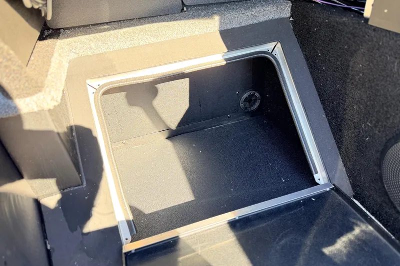 Slide: The Image of 2025 Alumacraft Competitor 185X Sport storage compartment interior. - 39