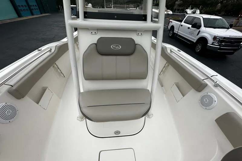 Slide: The Image of 2023 Key West 239 FS boat interior with seating and speakers. - 10