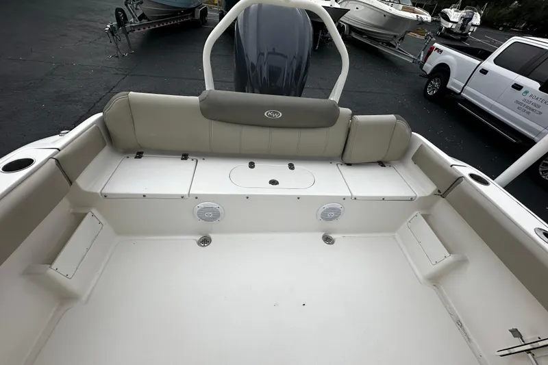 Slide: The Image of 2023 Key West 239 FS boat interior with seating and storage compartments. - 6