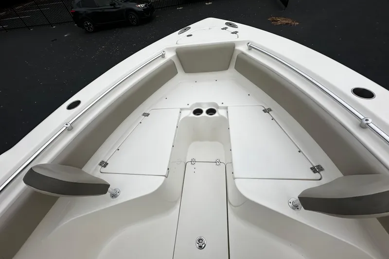 Slide: The Image of 2023 Key West 239 FS boat interior, featuring spacious seating and storage compartments. - 8
