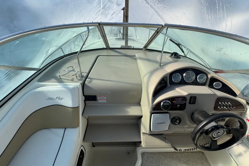 Slide: The Image of 2006 Sea Ray Sundancer 280 cockpit with steering wheel and instrument panel. - 14