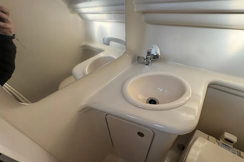 Slide: The Image of 2006 Sea Ray Sundancer 280 bathroom with sink and mirror. - 22