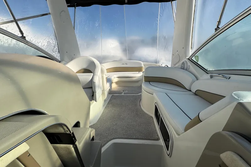 Slide: The Image of Interior of 2006 Sea Ray Sundancer 280 boat with plush seating and clear windows. - 25