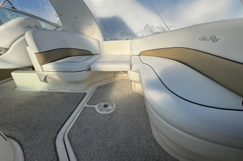 Slide: The Image of Interior of 2006 Sea Ray Sundancer 280 with plush seating and carpeted flooring. - 4