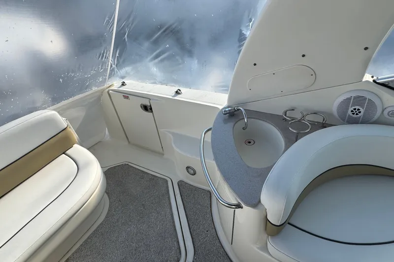 Slide: The Image of 2006 Sea Ray Sundancer 280 interior with seating, sink, and speaker. - 7