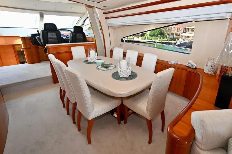 Slide: The Image of Luxurious dining area inside a 2005 Sunseeker 82 Yacht, featuring elegant seating and decor. - 13