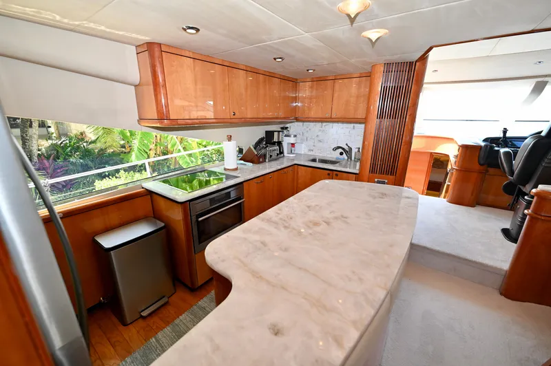 Slide: The Image of Luxurious kitchen interior of 2005 Sunseeker 82 Yacht with marble countertops and modern appliances. - 14