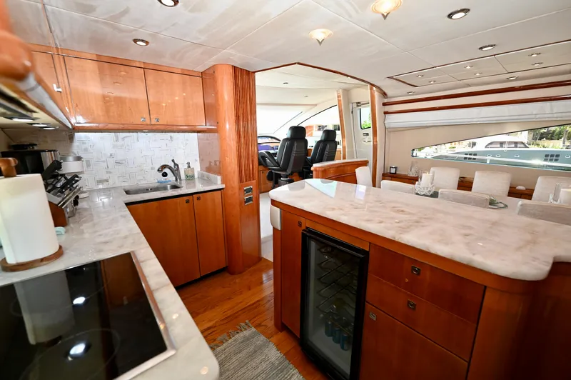 Slide: The Image of Luxurious interior of a 2005 Sunseeker 82 Yacht with elegant wood cabinetry and marble countertops. - 17
