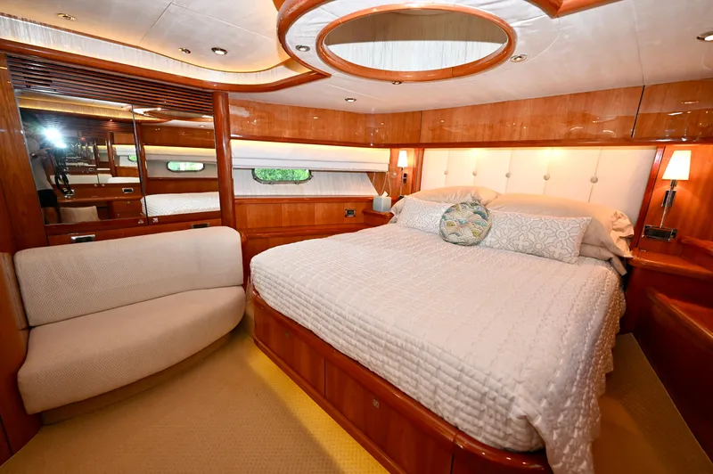 Slide: The Image of Luxurious bedroom interior of a 2005 Sunseeker 82 Yacht with elegant wood finishes. - 26