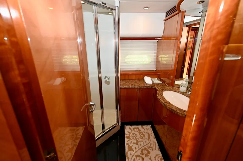 Slide: The Image of Luxurious bathroom in 2005 Sunseeker 82 Yacht with wood finish and modern amenities. - 28