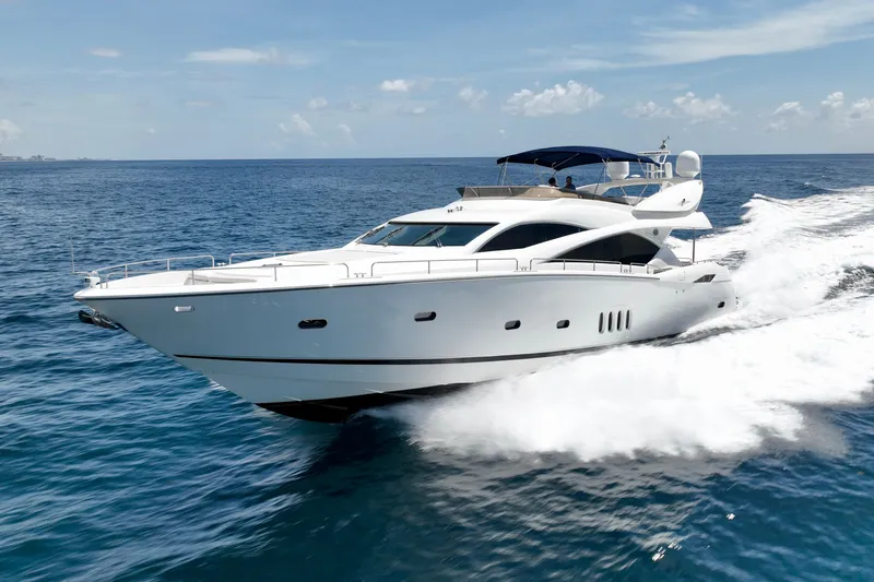 Slide: The Image of 2005 Sunseeker 82 Yacht cruising on open sea under clear skies. - 3
