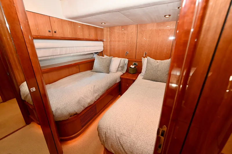 Slide: The Image of Luxurious twin bedroom on 2005 Sunseeker 82 Yacht with wooden finishes and cozy bedding. - 32